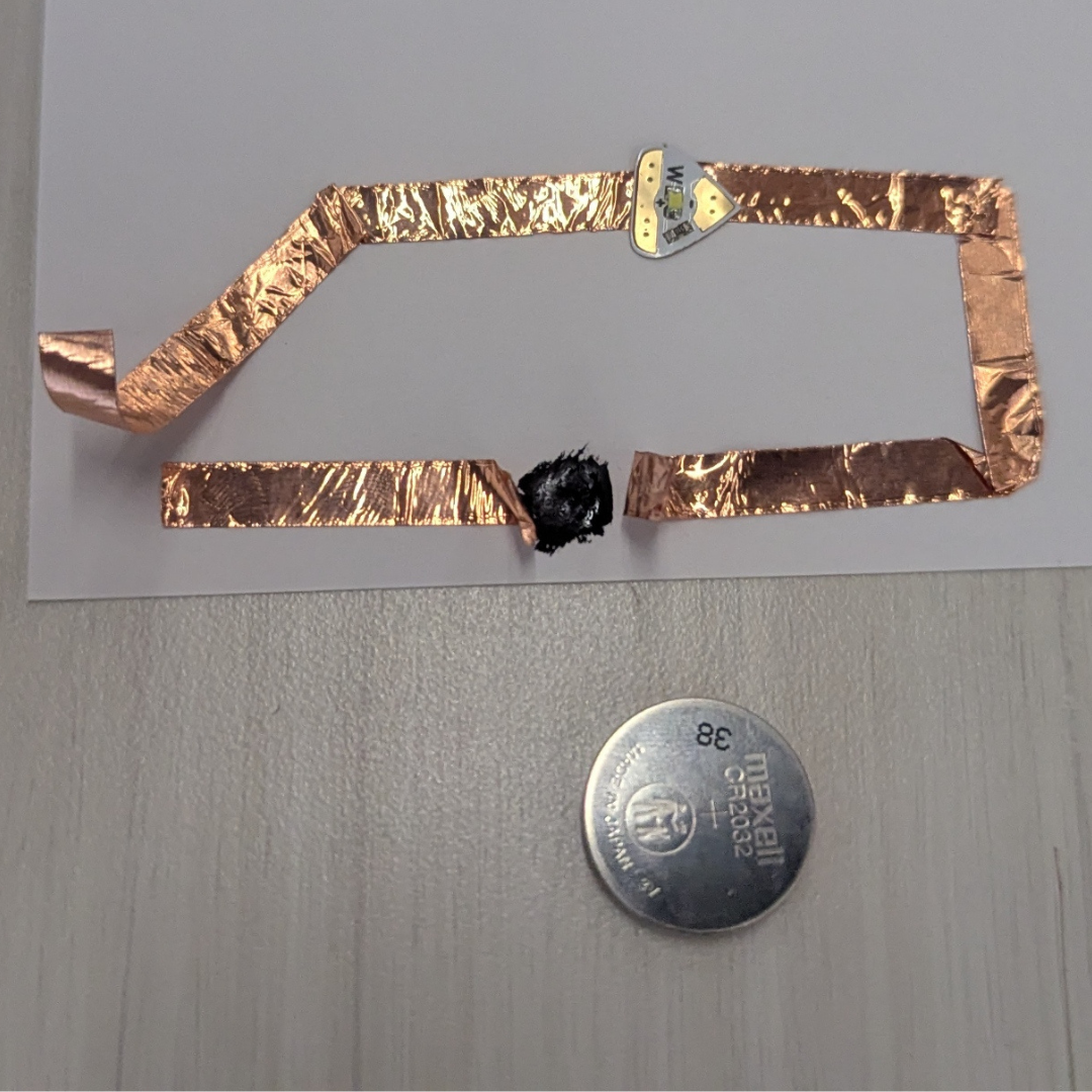 I wanted to experiment more, even if it's not working. I wanted to try and learn whether graphite painting can reconnect broken or separated copper-taped parts to transmit electricity to an LED light.